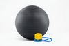 Black exercise ball with pump and resistance bands on a white background