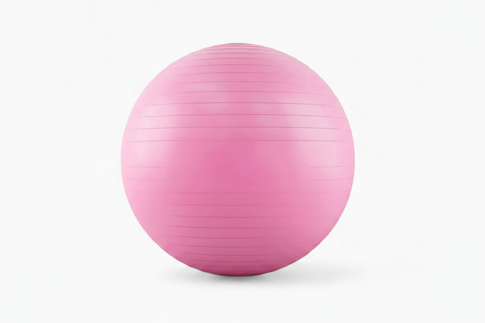 Pink exercise ball on a white background