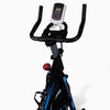 Black and blue exercise bike with digital display on a white background