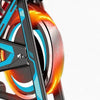 Close-up of on an exercise bike showing it at speed on a white background.