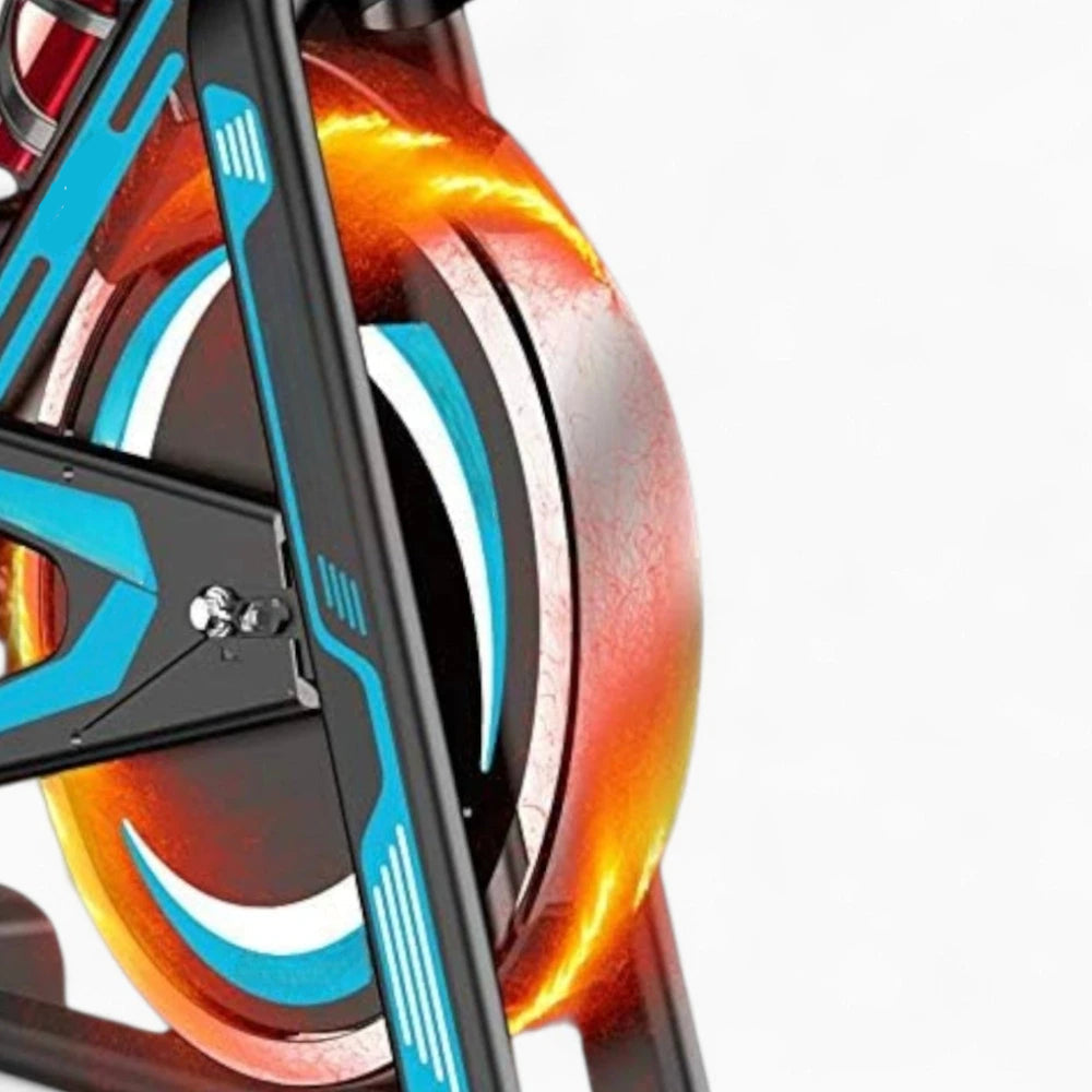 Close-up of on an exercise bike showing it at speed on a white background.