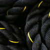 Close-up of black battle rope with yellow accents