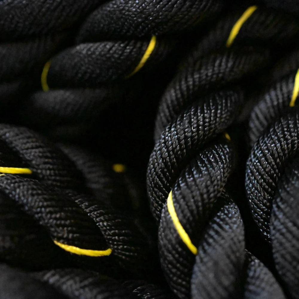 Close-up of black battle rope with yellow accents