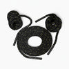 Set of black and yellow rope with gripped ends on a white background