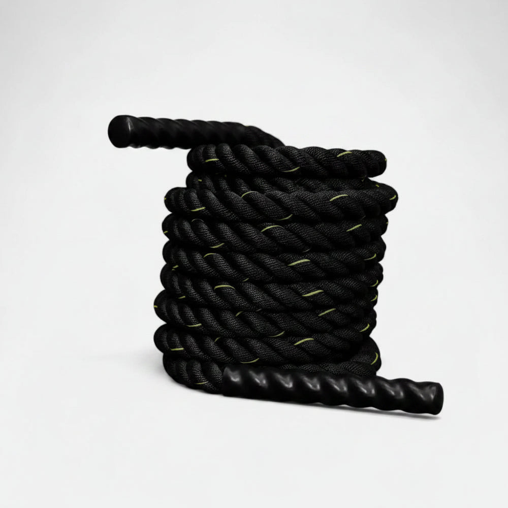 Black gym battle rope with yellow accents on a white background