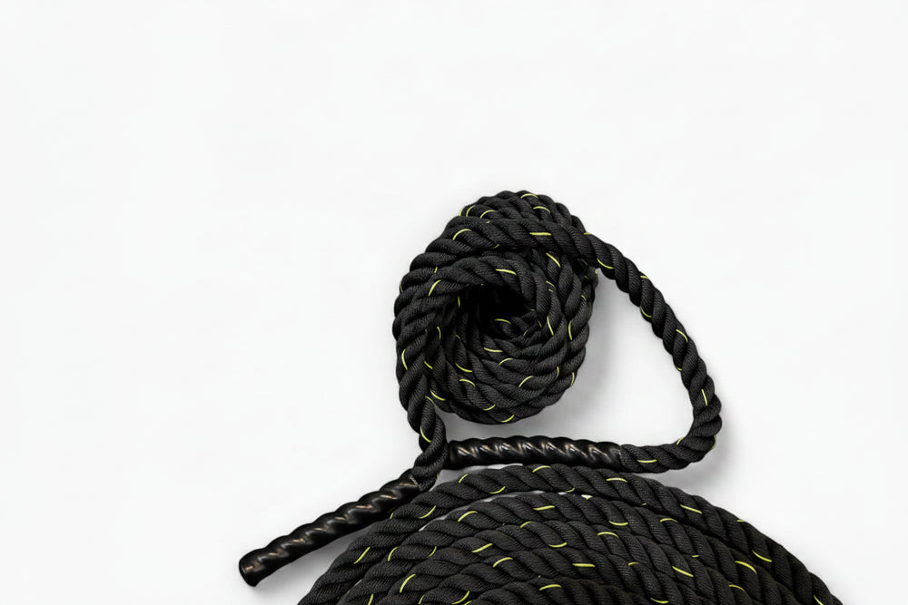 Black and yellow rope with a knot on a white background