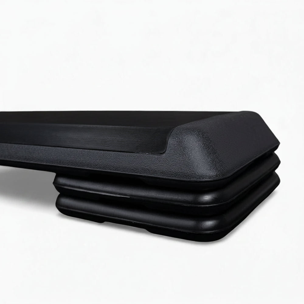 Black aerobics stepper on a white background