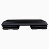 Black aerobics stepper with height adjustment on a white background