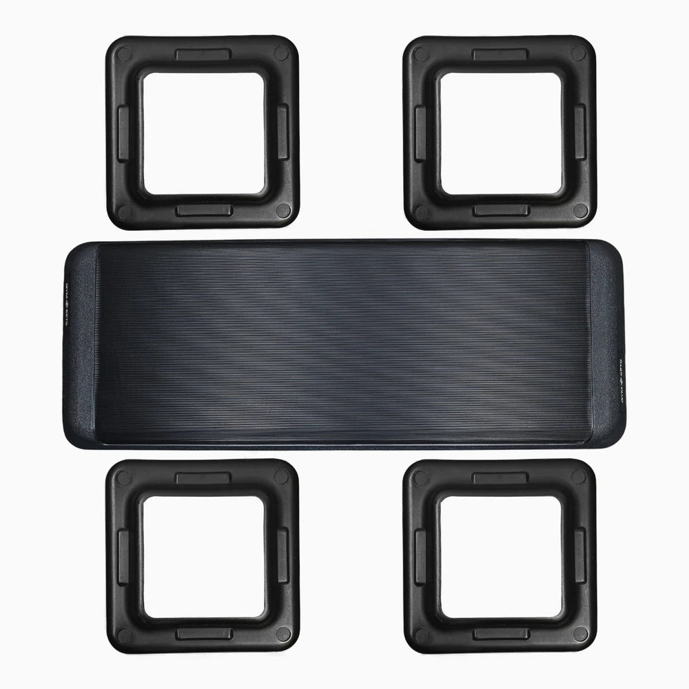 Aerobics stepper and 4 height attachment parts on a white background