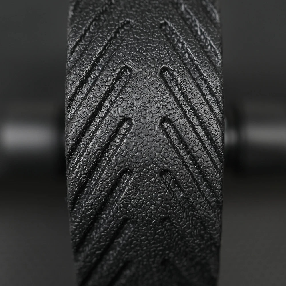 Close up of ab roller wheel on a dark background