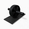 Black ab roller and mat on a white background