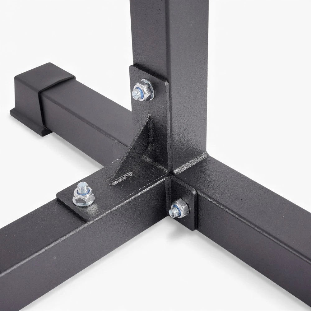 Close-up of a black strong metal frame corner with bolts on a white background