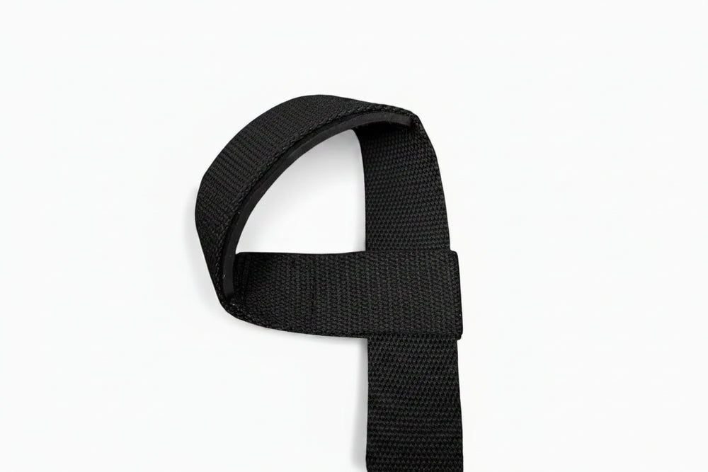Black weight lifting wrist strap on a white background