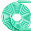 Coiled light green jump rope cable on a white background