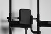 Black pull up dip bar gym machine on a gray background