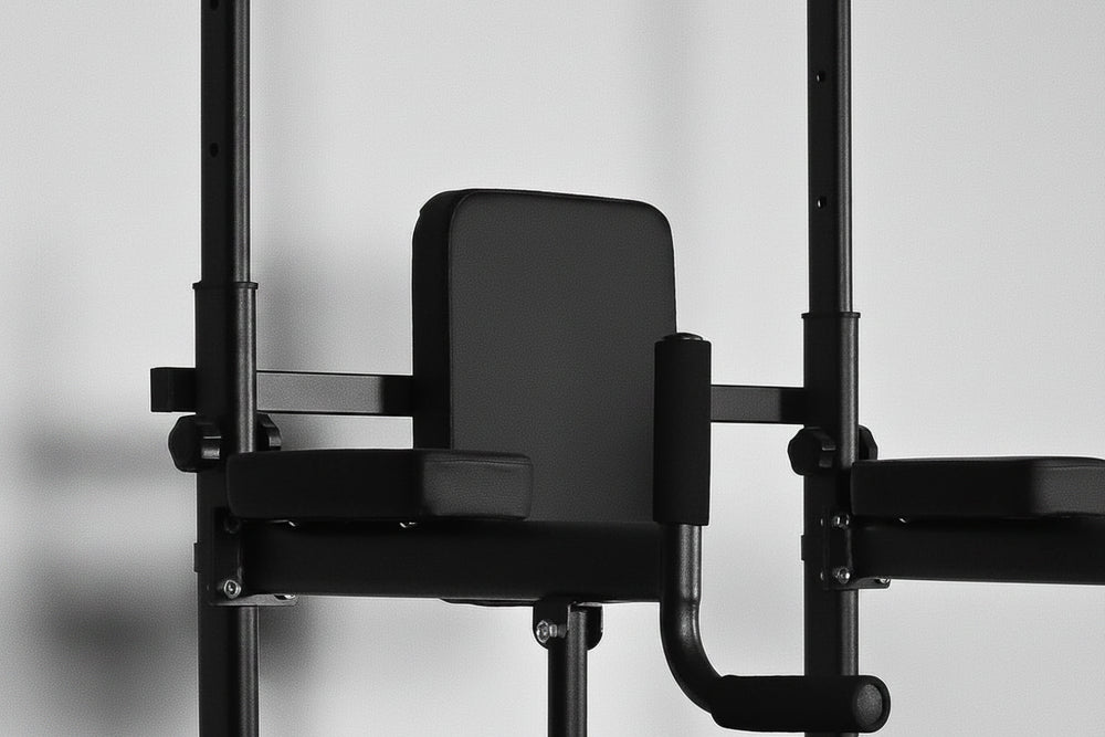 Black pull up dip bar gym machine on a gray background
