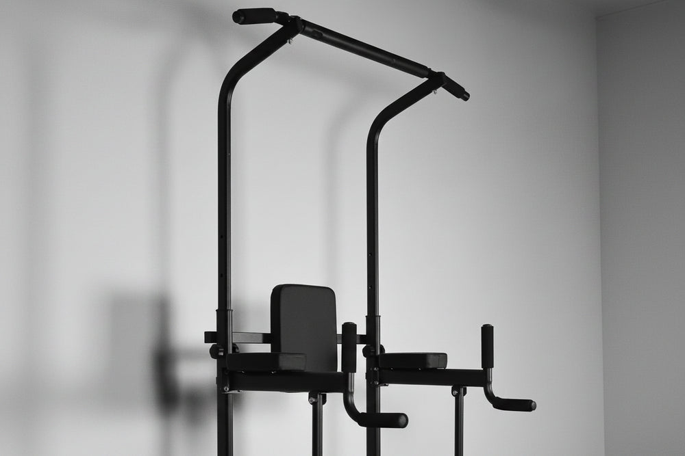 Black pull-up bar and workout station on a gray background