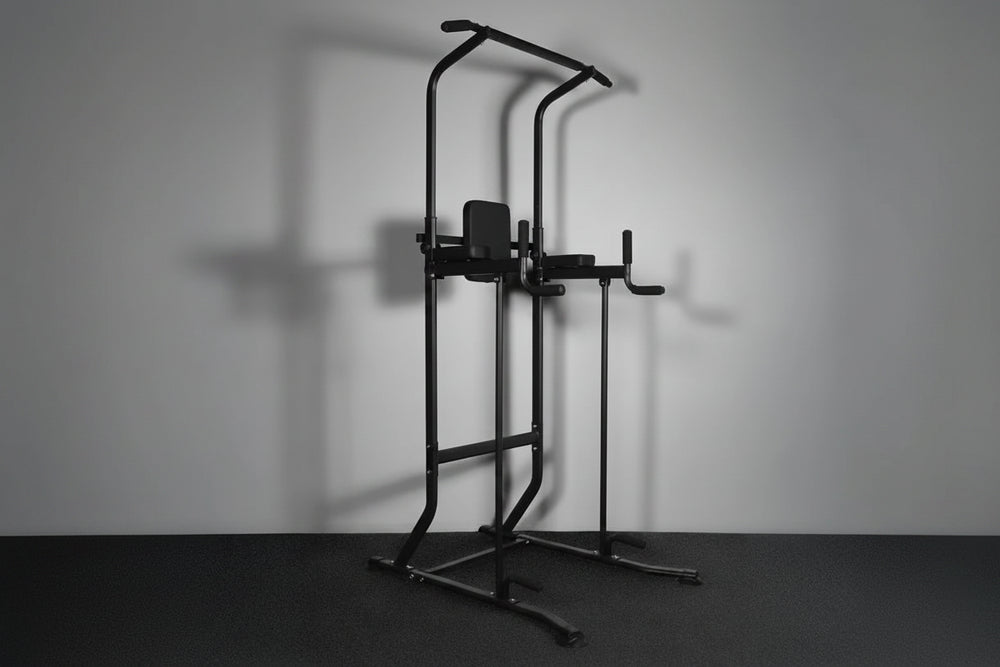 Black pull-up bar against a gray wall.