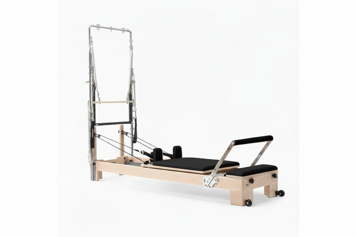 Pilates reformer tower in oak with black seats on a white background Main image