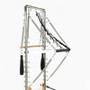 Pilates reformer tower on a white background