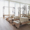 Pilates studio with many pilates reformer tower machines