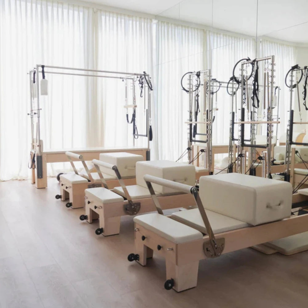 Pilates studio with many pilates reformer tower machines