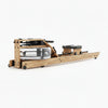 Wooden rowing machine with water tank on a white background