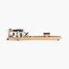 Wooden rowing machine with metallic components on a white background