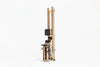 Folded rowing machine with wooden frame and black components on a white background