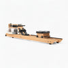 Wooden water rowing machine with black seats on a white background