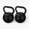 Two black adjustable kettlebells on a white background