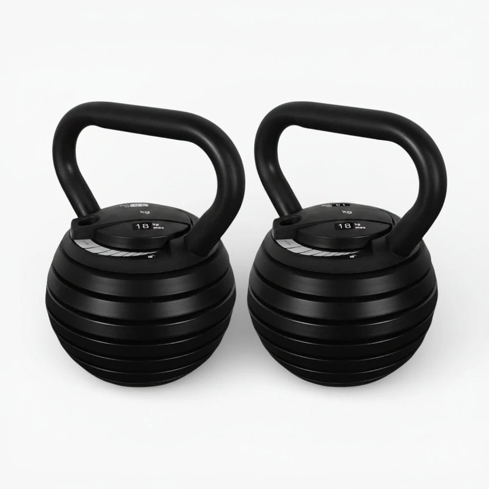 Two black adjustable kettlebells on a white background