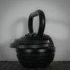 Adjustable kettlebell on a dark background