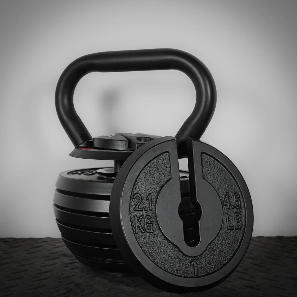 Black kettlebell with adjustable weight options on a dark background
