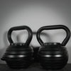 Two adjustable kettlebells on a dark background