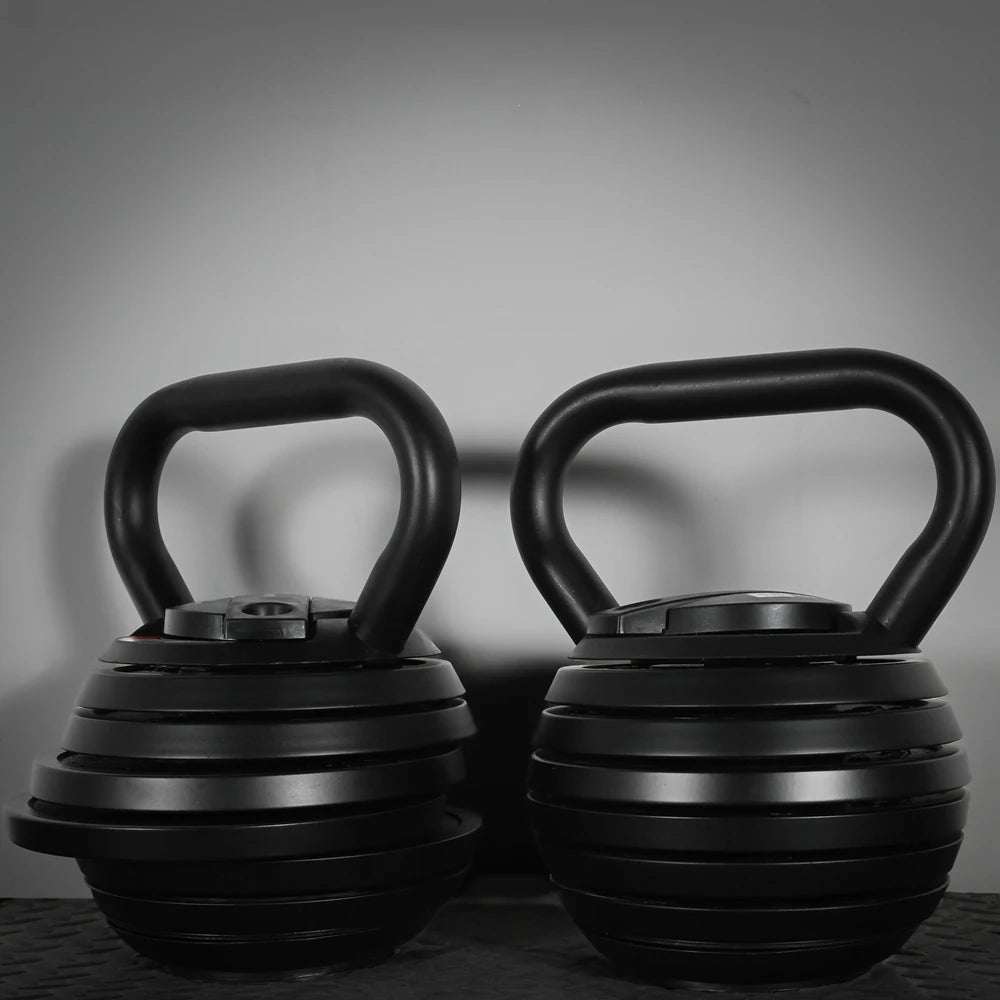 Two adjustable kettlebells on a dark background