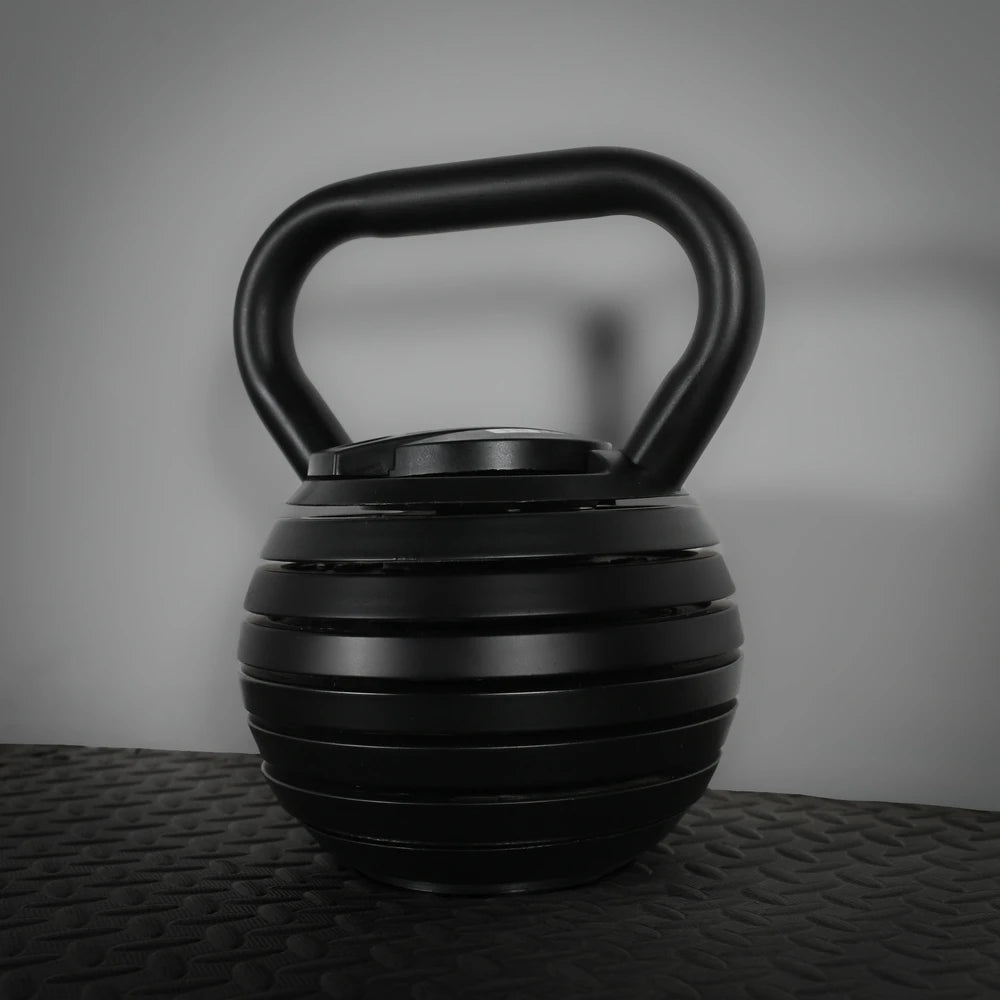 Single black adjustable kettlebell on a dark background