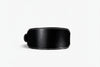 Black leather weight lifting belt on a white background