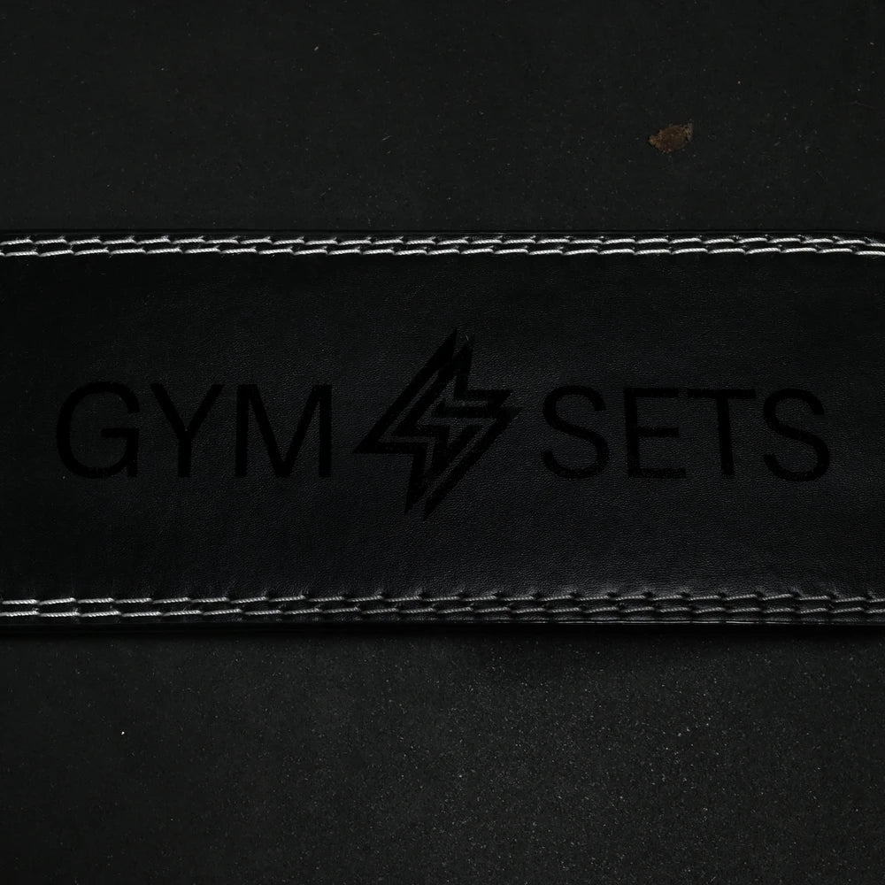 Black leather detail strap with white stitching