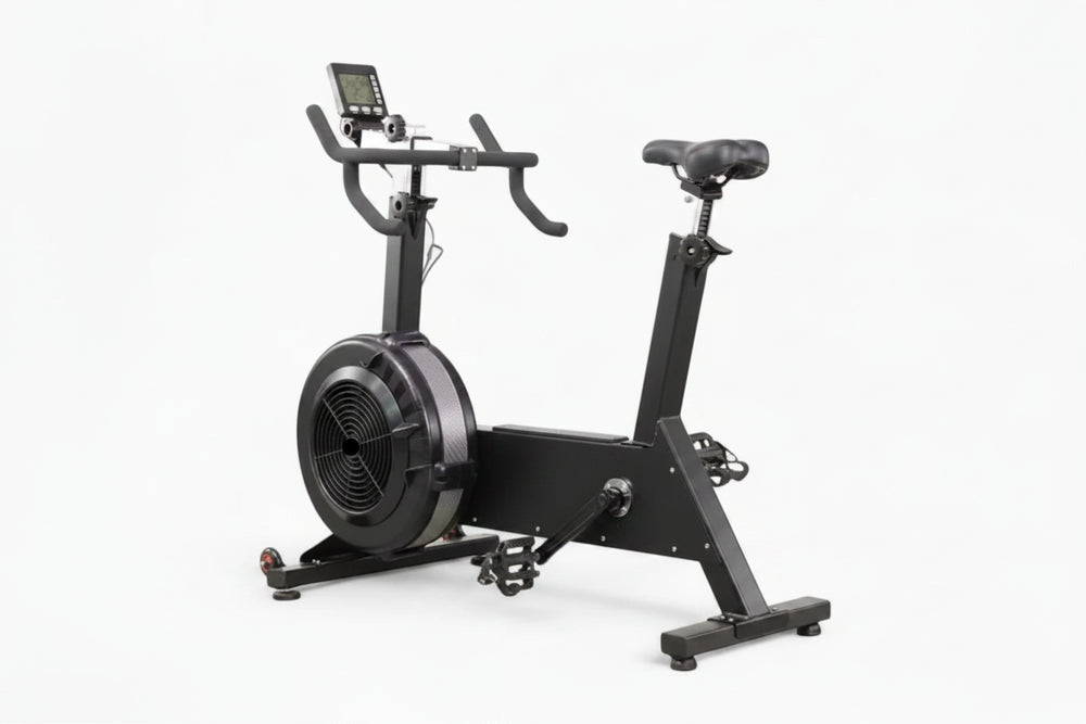 Black exercise bike with digital display on a white background