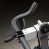 Handles of an exercise bike on a dark background