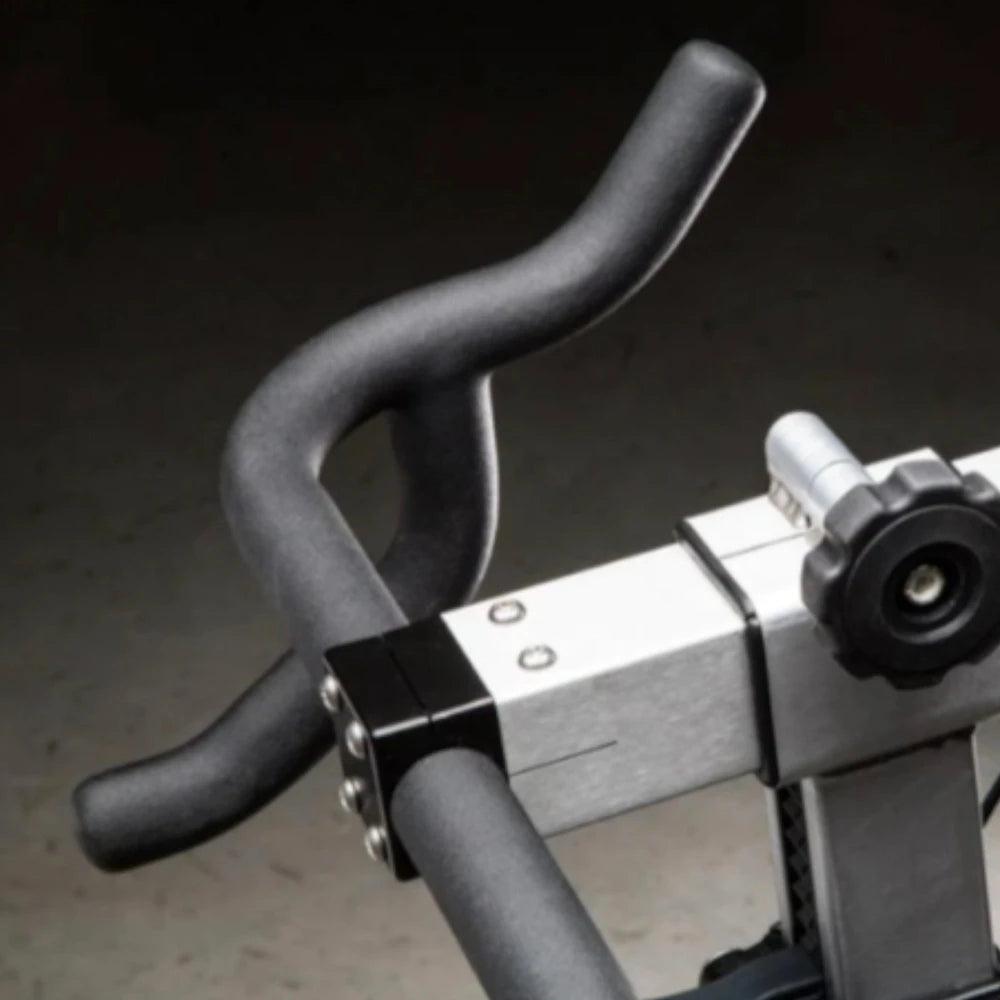 Handles of an exercise bike on a dark background