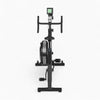 Black exercise bike with digital display on a white background