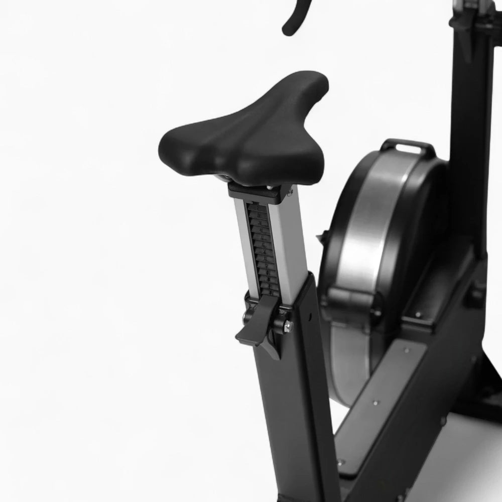 Seat of an exercise bike on a white background