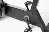 Close-up of a black exercise bike on a white background