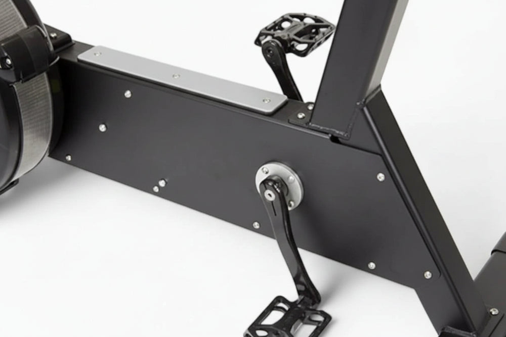 Close-up of a black exercise bike on a white background