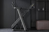 Folded treadmill on a dark background