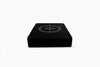 Black drop pads on a white background