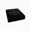 Black weights drop pad on a white background