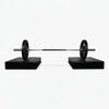 Barbell on weight pads against a white background